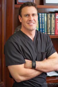 Kenneth Brown, M.D. board certified gastroenterologist in Plano TX seen here in his medical office